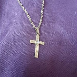 Cross necklace with faux diamond in  center of the cross